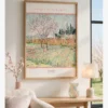 Vincent van Gogh's "Orchard with Cypresses," a poster of a Provençal garden featuring flowering fruit trees, yellow fences, and dark cypress trees